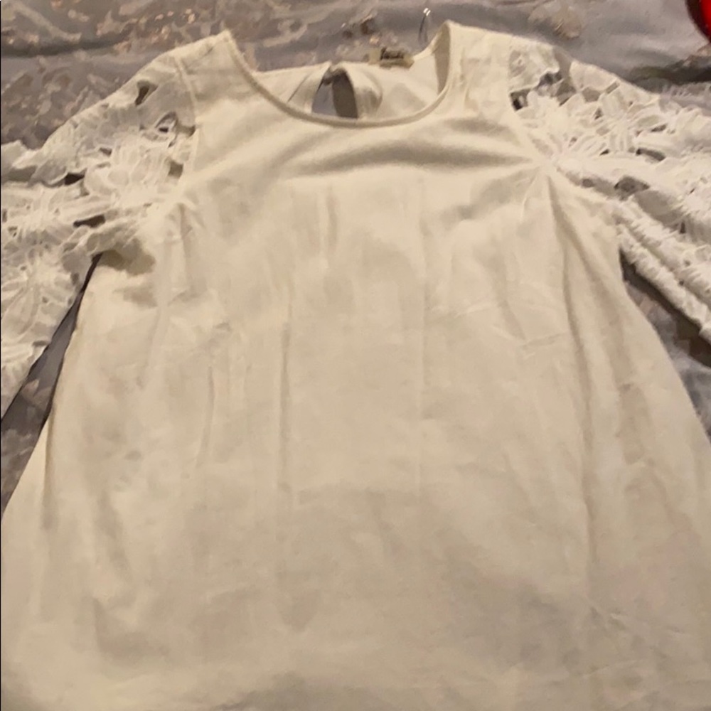 white dress with gorgeous embroidered sleeves